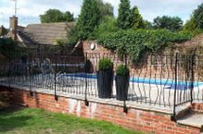 Iron gates around swimming pool